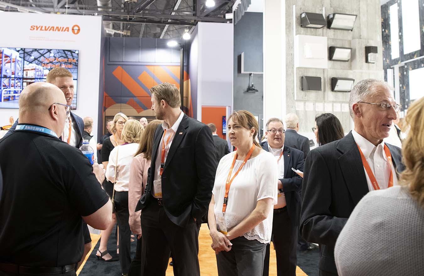 crowd gathers at tradeshow display