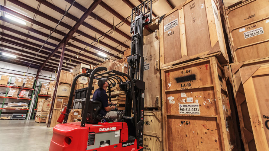 warehouse forklift moving wood crates